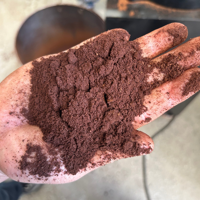 Freshly ground coffee from an industrial grinder