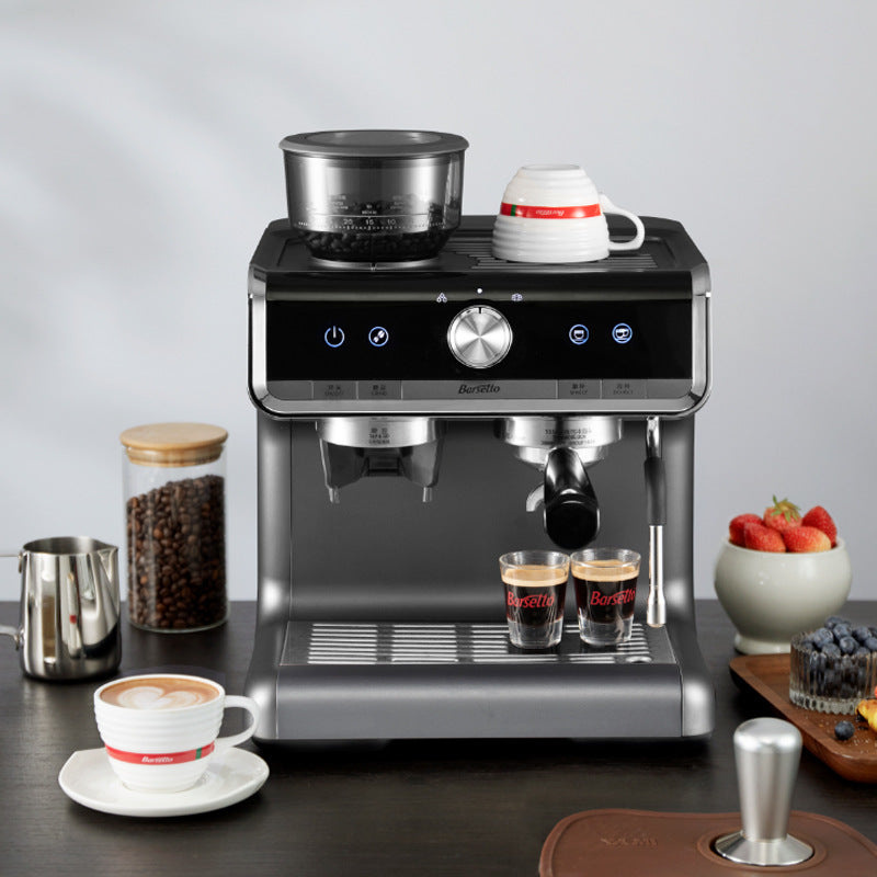 Semi-automatic espresso machine with built-in grinder pulling a shot
