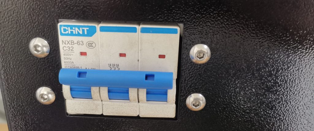 Circuit breaker on the electrical panel of a Yoshan coffee roaster