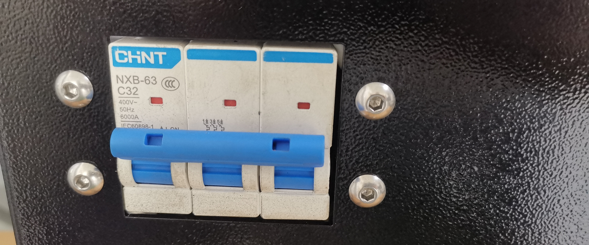 Circuit breaker on the electrical panel of a Yoshan coffee roaster
